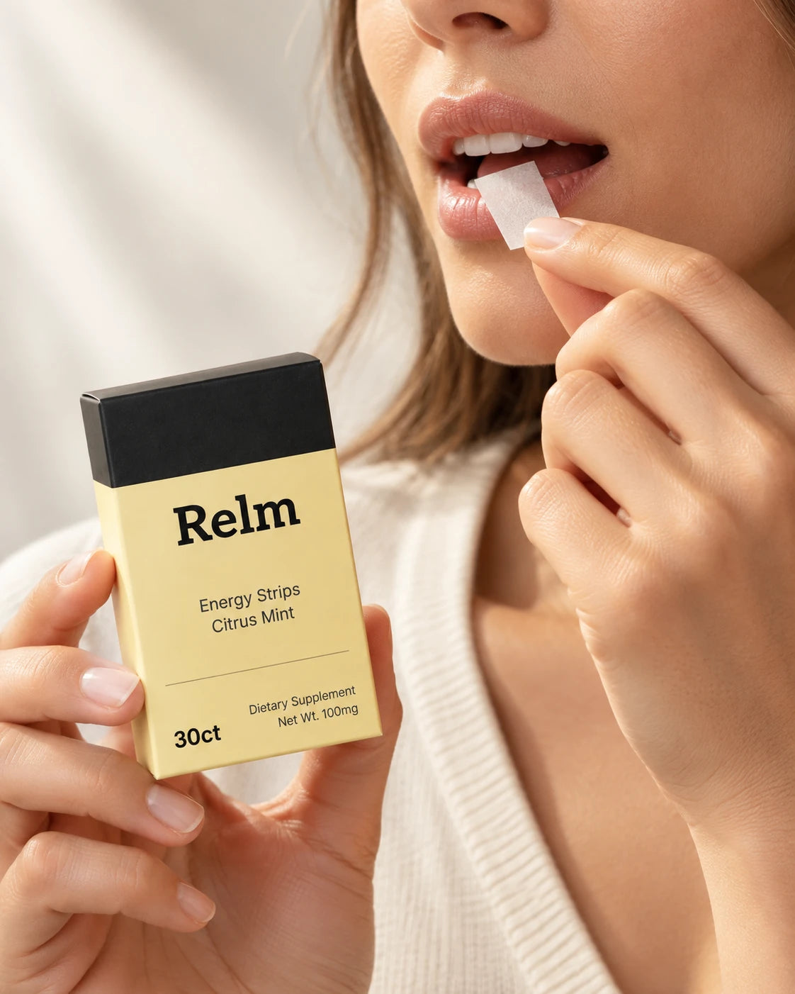 A single Relm strip being placed on the tongue